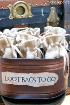 there are many bags in the trunk that says, loot bags to go on it