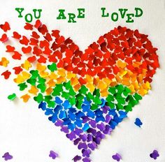 a rainbow heart with the words you are loved written on it