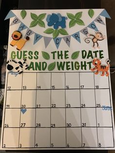 a calendar with stickers on it that says guess the date and weight in front of a jungle theme