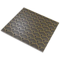 a black and gold art deco tile with fan design on it's side, against a white background