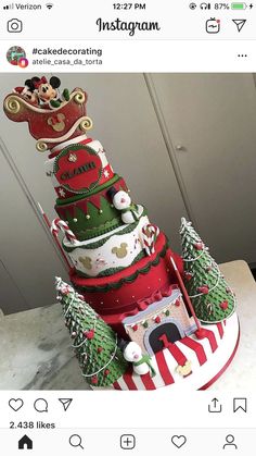 a large multi - tiered christmas cake on top of a table