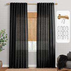 a living room with black curtains and a chair