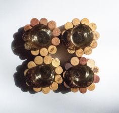 three wine bottles with corks in the middle