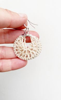 Crochet cream hoop earrings ! These beautiful crochet earrings are stunning and unique! Perfect as a gift for her for valentines or any other occasion!  There are 2 sizes to choose from:  Large hoops are 4cm  Small hoops are 2cm All my earrings are made with 925 stamped sterling silver earring hooks.  While every effort is made to maintain true colours in my listings, due to the nature of screen monitors, colours may be slightly different.  Care instructions: Please store in a cool dry place Take care with water as my earrings are water resistant but not waterproof  Free shipping  All earrings are handmade by me, in the sunshine state of Queensland! I hope you love your Jhoomka as much as I have making them! Handmade Beige Drop Earrings, Handmade Beige Earrings For Gift, Handmade Cream Earrings As A Gift, Handmade Cream Earrings For Gift, Handmade Beige Round Earrings, Handmade Cream Dangle Earrings, Handmade Cream Round Earrings, Handmade Cream Drop Earrings, Beige Hoop Earrings For Gift