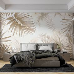 a large bed sitting under a window next to a plant wallpaper covered in leaves