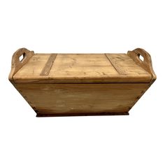 a large wooden box with handles on the top and bottom, sitting against a white background