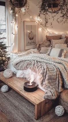 a bed room with a neatly made bed and christmas lights on the wall above it