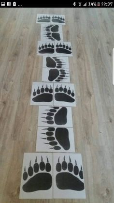 four black and white footprints are on the floor