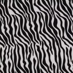 an animal print fabric with black and white stripes