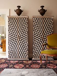 two tall wooden cabinets sitting next to each other on top of a carpeted floor