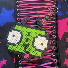 Gir keychain about 7 inches long hanging including the clip normally has small pink heart too Also super cute just on your wall like in the last pic :) Made to order so it won't look exactly like this if you have bead preferences leave it in the notes or message me <3 Beads Keychain Design, Gir Perler Pattern, Y2k Perler Beads, Cute Perler Bead Ideas, Small Perler Bead Patterns, Perler Keychain, Alt Crafts, Perler Bead Keychain, Fused Beads