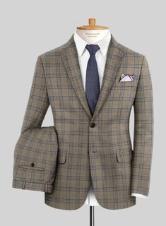 Seal your formal look with a suave piece like our Reda Sand Brown Checks Wool Suit. Tailored using superior-quality wool material, this suit is a must-have addition to your esteemed collection. The overcheck pattern, featuring blue yarns on a calm brown tone, reflects an updated vision of luxury tailoring. For men who wish to dress in a more upscale manner, this suit is a perfect choice. 
 
 Look Includes   Reda     Sand     Brown     Checks     Wool  Fabric  Two Button Jacket Style  Notch Lapel Elegant Plaid Blazer For Business, Elegant Plaid Suit For Semi-formal Occasions, Elegant Plaid Semi-formal Blazer, Elegant Plaid Blazer For Semi-formal Occasions, Elegant Semi-formal Plaid Blazer, Plaid Wool Suits For Formal Occasions, Elegant Plaid Suit With Notch Lapel, Elegant Plaid Tweed Jacket With Suit Collar, Elegant Plaid Business Suit