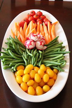 a white plate topped with lots of different types of vegetables