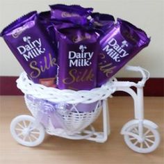 a basket filled with dairy milk chocolates on top of a table