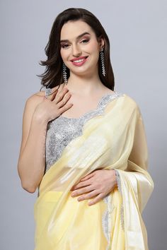 Embrace the elegance and versatility of our Candie Yellow Soft Organza Scallop Border One Minute Saree, for it's a timeless piece that celebrates your unique beauty. Pink Shine adds glamour and intrigue to this elegant and unique saree!The Regal Yellow Shine Organza Net Saree is a dazzling choice that effortlessly transitions from festive wear to a stunning addition for weddings and special occasions.Its deep and rich tone captures attention and radiates a sense of elegance. With a shimmering y Glamorous Festive Pre-draped Saree For Celebration, Elegant Festive Pre-draped Saree With Dupatta, Elegant Festive Lehenga With Unstitched Blouse, Elegant Festive Pre-draped Saree With Unstitched Blouse, Elegant Party Pre-draped Saree With Zari Work, Elegant Festive Sets With Unstitched Blouse, Elegant Pre-draped Saree For Wedding And Eid, Elegant Evening Sets With Unstitched Blouse, Elegant Festive Georgette Blouse Piece