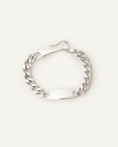 Unisex classic ID bracelet with an organic shaped plate. Closes with a unique elongated hook. Modern Sterling Silver Bracelets With Hook And Links, Classic Sterling Silver Bracelet With Hook And Links, Modern Sterling Silver Bracelet With Hooks And Links, White Gold Sterling Silver Bracelet With Hooks And Links, Classic Silver Bracelets With Hook-and-link, Sterling Silver Bracelets With Hook And Links Classic Style, Classic Sterling Silver Bracelets With Hook And Links, Classic Silver Bracelet With Hooks And Links, Modern Engraved Sterling Silver Chain Bracelet