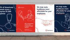 two billboards on the side of a building advertising health care for employees, and we help make healthcare more effortable for your employees