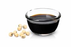 soy beans in a glass bowl next to some oil