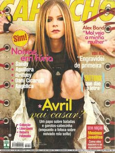 a magazine cover with an image of a woman in black shirt and jeans on it