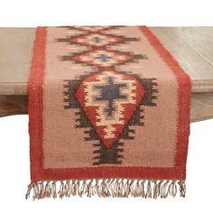 a table runner with a cross on it