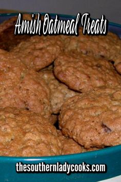 some cookies are in a blue bowl on a table