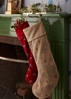 a christmas stocking hanging from a fireplace mantel