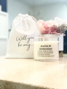 a candle and bag sitting on top of a counter