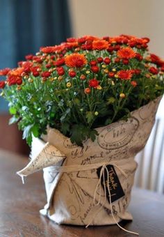 a bunch of flowers that are sitting on a table