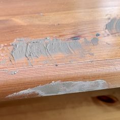 a wooden table with some paint on it