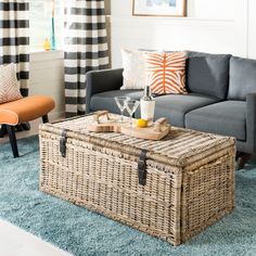 a living room with two couches and a coffee table in front of a window