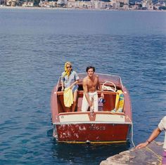 two people on a boat in the water