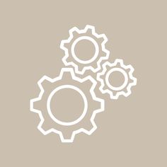 three gears on a gray background