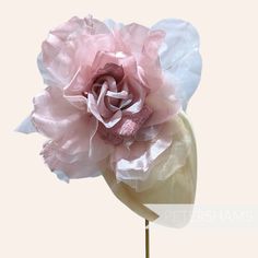 WOWZA! Meet 'Pricilla', by far our largest and most flamboyant millinery flower. Ideal for Royal Ascot, this over-the-top dusky pink flower is made up of giant floaty organza and silk petals with velvet accent petals at it's centre. It's an absolute whopper of a flower!  Try putting two on a fascinator base or headband for an instant statement hat!  Flower measures: Width: Around 25cm (10 inches) when splayed out Length of wired stem: 9cm (3.5 inches) For our full range of velvet hat flowers vis Canterbury England, Statement Hat, Hat Flower, Velvet Hat, Velvet Accents, Velvet Flowers, Flower Hats, Dusky Pink, Royal Ascot