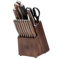 a set of knives in a wooden holder