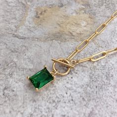 * DETAILS * * Gold Filled Necklace - Copper Based with 14K Gold Filled Chain - 14K Gold Filled Toggle Clasp 9mm - Gold Plated Emerald Crystal Glass Pendant 9mm*7mm - 14K Gold Filled Link Rings 👉🏻 You may also like the matching earrings in the photos. Here is the link. https://www.etsy.com/JinnysJewelryBySeJin/listing/955323557/emerald-huggie-earrings?utm_source=Copy&utm_medium=ListingManager&utm_campaign=Share&utm_term=so.lmsm&share_time=1612684001759 * WHAT IS GOLD FILLED * Go Emerald Stone Jewelry, Stone Pendants Gold, Emerald Pendant Necklace, Emerald Green Necklace, Emerald Necklace Pendant, Peridot Color, Necklace Clasp, Sophisticated Jewelry, Emerald Crystal