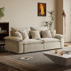 a living room filled with furniture and a painting on the wall