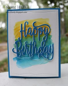 a handmade birthday card with the words happy birthday written in blue and yellow ink