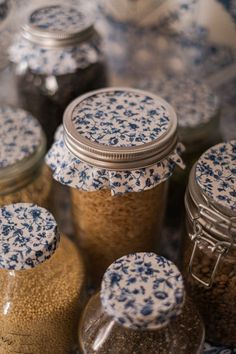 several jars with blue and white designs on them