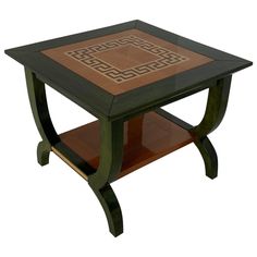 a wooden table with an intricate design on the top