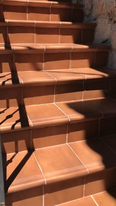 some brown steps with shadows on them