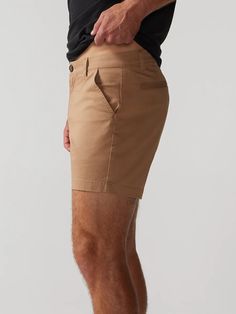 Built for those classy moments where you gotta dress your casual shorts up. Made with our classic Originals spandex stretch fabric in a classier, more tailed fit, the Flat Front shorts are designed to give you that elevated chino look without sacrificing comfort. They rock a non-elastic waistband and oxford lined pockets, so whether you're headed to the golf course or a casual lunch meeting, you can feel confident that all of your necessities are safe and secure. Fabric: 98% cotton / 2% spandex Fitted Shorts With Pockets And 5-inch Inseam, Stretch Cotton Shorts With 5-inch Inseam, Slim Fit Bottoms For Business Casual Summer, Slim Fit Bottoms For Summer Business Casual, Summer Business Casual Slim Fit Bottoms, Slim Fit Summer Bottoms Short Length, Fitted Solid Shorts For Business Casual, Slim Fit Summer Shorts, Stretch Bottoms For Business Casual In Summer