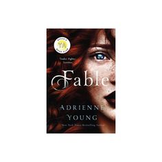 the book cover for fable by adrienn young, with an image of a woman's face and freckled hair