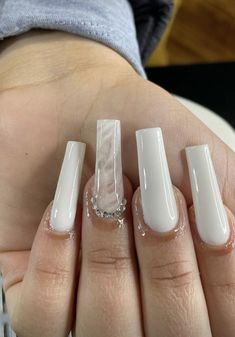 a person with white nail polish on their nails