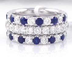 three wedding rings with blue and white stones on each band, set in 18k white gold