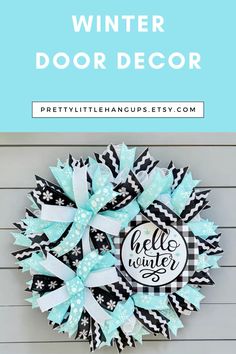 a black and white wreath with the words winter door decor on it