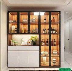 a kitchen with lots of bottles on the shelves