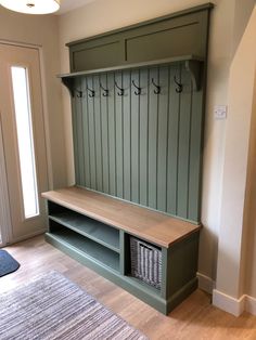 a wooden bench sitting in the corner of a room