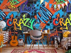 graffiti wallpaper in an eclectic bedroom with colorful furniture and rugs on the floor