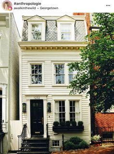 a white house with black doors and windows