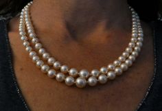 Necklace composed of 2 rows of cultured pearls, clasp set with 3 diamonds, 18 carat white gold. Estimated weight of the central diamond in old cut: 0.22 carat. 2 other diamonds of 0.05 carat each. Clasp length in 18 carat white gold: 16,3 mm. Security chain. French hallmark: Eagle's head. Diameter of the beads: from 5.92 mm to 8.70 mm for the 1st row. Diameter of the beads: from 6.20 mm to 8.75 mm for the 2d row. Collar length: 48 cm. Necklace delivered in a case and with an invoice. Free and insured shipping. Formal Double Strand Pearl Necklace With Pendant, Formal Double Strand Pearl Necklace, Double Strand Pearl Necklace For Formal Occasions, Classic Pearl Necklace With 17 Jewels For Wedding, Classic Evening Necklaces, Formal Vintage Akoya Pearl Necklace, Classic Double Strand Pearl Pendant Jewelry, Formal Double Strand Pearl White Jewelry, Classic Pearl Necklace With Jewels For Anniversary